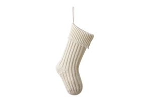 Detail view of white knitted Christmas stocking featuring thick yarn texture and hanging loop