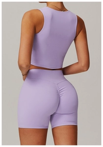 Detail of lavender fitness set featuring high-waisted scrunch butt shorts for yoga