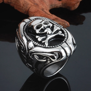 Detailed macro shot of vintage silver punk skull ring with rustic stainless steel texture