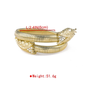 Macro detail of gold snake bracelet showing 6cm inner diameter and 51.6g weight metrics