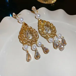 French vintage gold drop earrings with pearls and crystals in a luxury hollow design