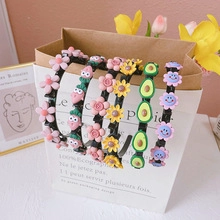 Collection of colorful resin hair clips with flower, strawberry and avocado designs