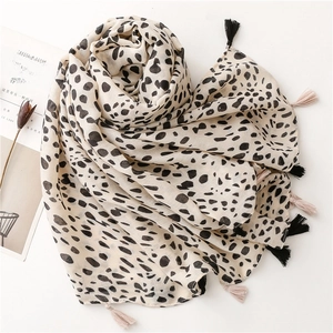 Elegant cream winter scarf with black dalmatian spots and fringe tassels for women
