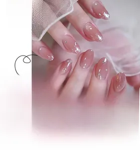 Detailed view of pink gradient oval press-on nails with silver glitter and tiny rhinestones