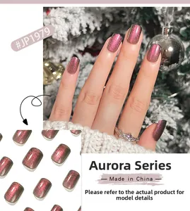 Close-up of red-brown cat-eye nails from Aurora series #JP1979 in Christmas setting