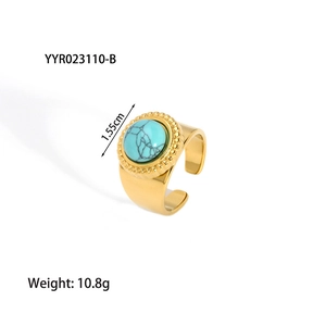 Detail of 18K gold-plated stainless steel ring featuring round turquoise stone inlay