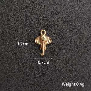 Polished gold elephant charm for DIY jewelry showing dimensions 1.2cm by 0.7cm and 0.4g weight
