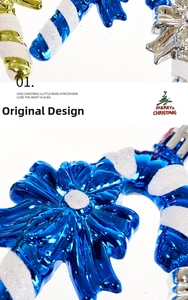 Detail of glittery blue and gold candy cane ornaments with festive bow for Christmas trees