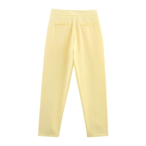 Detailed back view of light yellow suit trousers featuring double welt pockets and clean cut