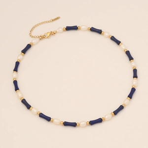 Detailed view of bamboo-style necklace with blue stones, pearls, and gold-tone clasp