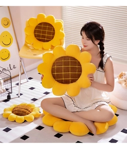 Close-up of plush sunflower cushion showing soft yellow petals and brown textured center
