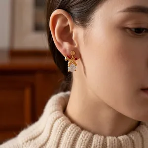 18k gold-plated unicorn stud earrings with red enamel and clear crystal pendant