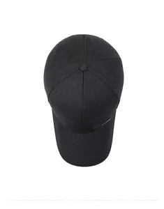 Top down view of a classic black cotton baseball cap for middle-aged men with metal logo