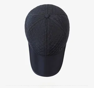Detailed top view of a black quilted baseball cap with warm diamond stitching pattern