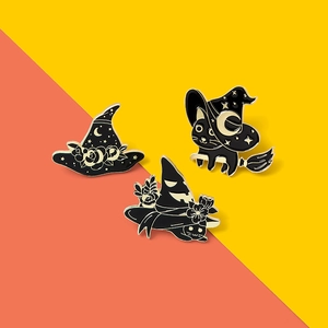 Three-piece Halloween enamel pin set with black cat and witch hat on bicolour background