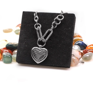 Classic silver stainless steel heart pendant necklace on display stand