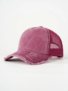 Detail showing breathable mesh back and vintage washed fabric with distressed edges on cap
