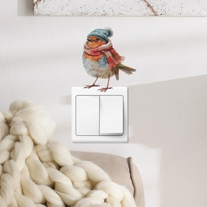 Sticker mural oiseau de Noël mignon avec bonnet d'hiver sur interrupteur blanc