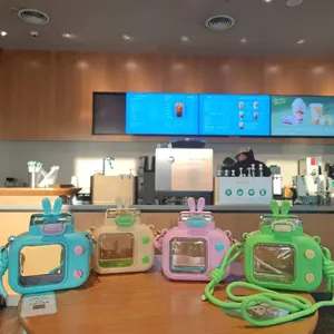 Creative TV-shaped kids water bottle with bunny ears and adjustable shoulder strap