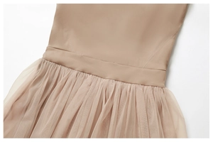 Detail of waist stitching and pleated mesh skirt on beige 2-in-1 tennis dress