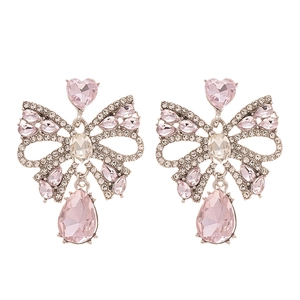 Elegant silver earrings with pink crystal bows and teardrop-shaped rhinestone tassels