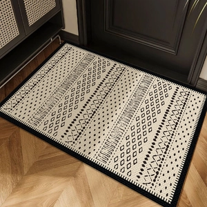 French vintage style rectangular beige doormat with black tribal geometric patterns