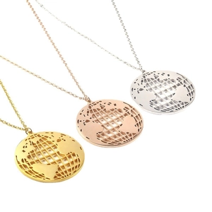 Minimalist world map globe pendants in gold, rose gold, and silver on O-chains