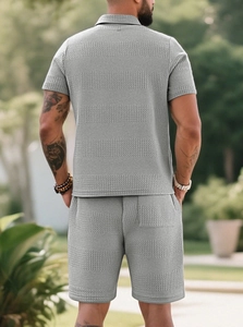 Rear view of men's grey knit two-piece set featuring waffle texture polo shirt and shorts