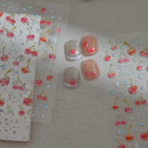 Sparkling cherry nail art stickers with 3D glitter effect on transparent sheets