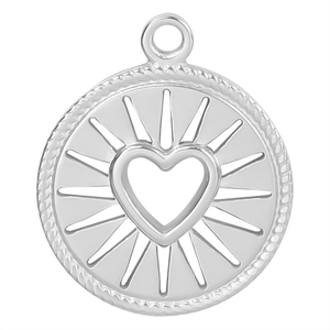 Macro shot of a silver heart charm with radiant texture and rope edge for DIY jewelry