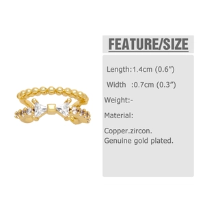 Detailed view of gold bow ear cuff with clear cubic zirconia stones and sizing metrics