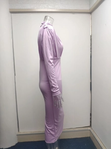 Detail view of the purple slim-fit dress showing stretch fabric and high collar fit