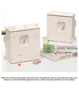 Close-up of ivory upright piano music boxes with ballerina figurine and jewelry storage