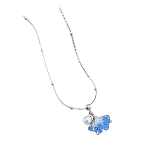 Elegant ginkgo leaf necklace with blue zircon crystals and white pearl on silver chain