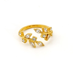 Detail of 18K gold leaf ring with white marquise zircons and leaf design on white background