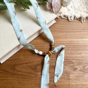 Floral print chiffon ribbon choker necklace with wooden beads and acrylic accents detail