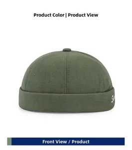 Front view of army green cotton brimless docker cap with white cursive embroidery detail