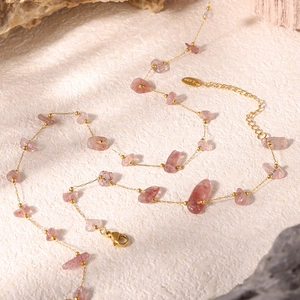 Detail of pink natural stone necklace with gold stainless steel chain and lobster clasp