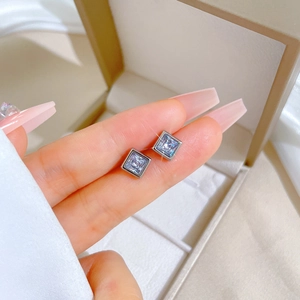 Handheld square cubic zirconia stud earrings in polished titanium steel for a modern look