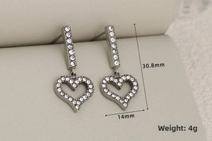 Detailed view of silver heart drop earrings with dimensions 30.8mm by 14mm and 4g weight