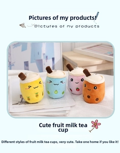 Detailed view of four colorful fruit bubble tea plush keychain charms on white fabric