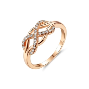 Rose gold infinity knot ring with pavé cubic zirconia on a clean white background