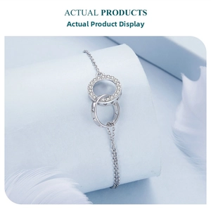 Close-up of S925 silver double-interlocking rings with zircon stones and hollow heart detail