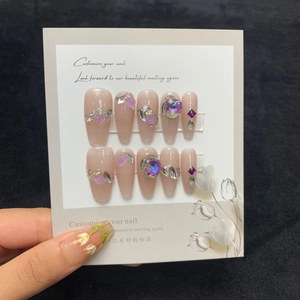 Handmade press-on nails in sheer nude with aurora crystals and silver metal accents