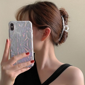 Minimalist large transparent shark hair claw clip showing a secure back head bun style