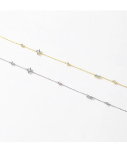 Close-up of gold and silver S925 necklaces with square zircon stones on a white background