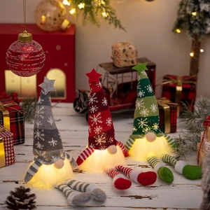 Three lit Christmas gnomes in grey, red and green with striped legs and knit hats