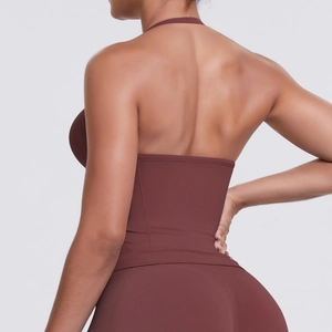 Macro shot of dark reddish-brown high-stretch fabric and open-back cross strap detail
