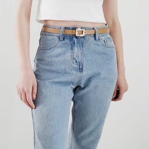 Vintage camel PU leather skinny belt with rhinestone rectangle buckle on denim pants