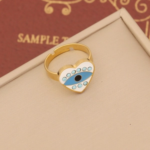 Evil eye heart open ring in gold stainless steel with blue enamel on jewelry box